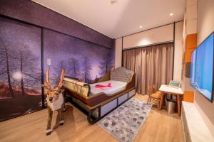 Postel nebo postele na pokoji v ubytování Shangri-La Harbin