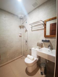 a bathroom with a toilet and a sink and a shower at Mclane Boutique Hotel in George Town +96 photos