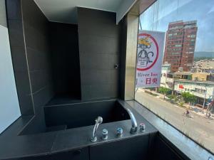Fotografie z fotogalerie ubytování Love River Inn 愛河日央 v destinaci Kao-siung