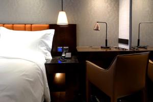 Rúm í herbergi á Tango Inn Taipei ZhongShan