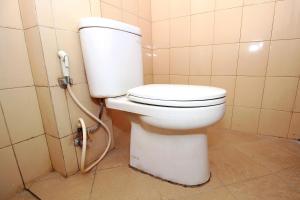 Vonios kambarys apgyvendinimo įstaigoje Super OYO 1678 Jati Exclusive Homestay