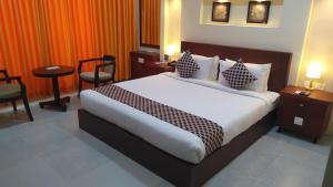 Postel nebo postele na pokoji v ubytování Rouba Residency Hotel