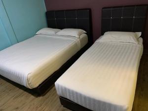Postel nebo postele na pokoji v ubytování Elmark Hotel Kuantan