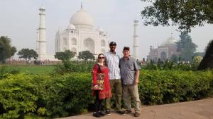 a group of people standing in front of the taj mahal at Aradhana's Home Stay in Agra