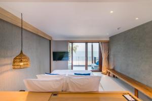 A television and/or entertainment centre at Lullaby The Sea Hua Hin