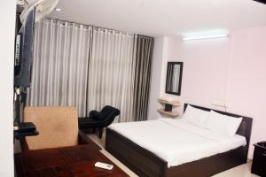 Posteľ alebo postele v izbe v ubytovaní MALAPPURAM RESIDENCY