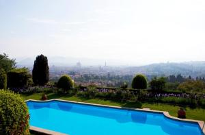 a large pool of water with trees at Hotel Torre di Bellosguardo in Florence