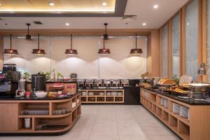 
A restaurant or other place to eat at Ramada by Wyndham Phuket Deevana Patong - SHA Plus
