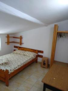 Un pat sau paturi într-o cameră la Casa Pinciuc Costinesti