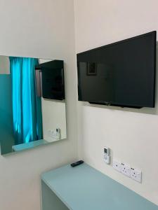 TV a/nebo společenská místnost v ubytování Fairway Hotel