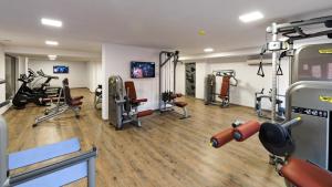 a gym with several treadmills and machines at Wine & Spa Complex Starosel in Starosel