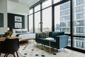 a living room filled with furniture and a window at Sonder South Wabash in Chicago