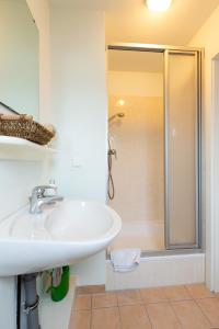 a bathroom with a sink and a shower at Deutsche Messe Zimmer - Private Rooms Hannover Exhibition Center (room agency) in Hannover