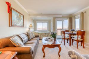 a living room with a couch and a table at Sugar Ski 11-202 in Sugar Mountain