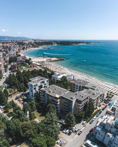 an aerial view of a beach with buildings and the ocean at Olympia Beach Complex in Ravda