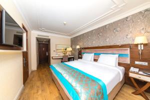 Ліжко або ліжка в номері Grand Yavuz Hotel Sultanahmet