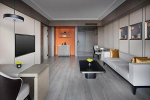 TV a/nebo společenská místnost v ubytování Tian Yi International Hotel 天艺国际酒店