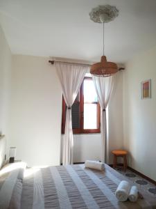 Postel nebo postele na pokoji v ubytování In vacanza a Itri - Casa Ileana