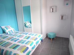 En eller flere senge i et værelse på T2 Tarnos avec piscine