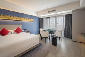 Postel nebo postele na pokoji v ubytování Tian Yi International Hotel 天艺国际酒店
