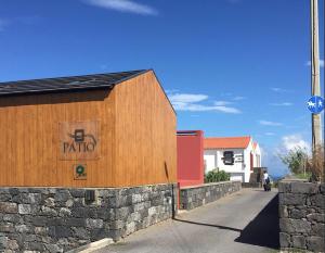 a building with a sign on the side of it at Pátio Ecolodge in Cedros