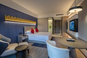 Postel nebo postele na pokoji v ubytování Tian Yi International Hotel 天艺国际酒店