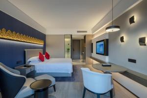 Postel nebo postele na pokoji v ubytování Tian Yi International Hotel 天艺国际酒店