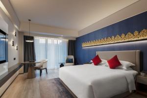 Postel nebo postele na pokoji v ubytování Tian Yi International Hotel 天艺国际酒店