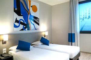 Postel nebo postele na pokoji v ubytování AN Hotel Dépendance Milano Melegnano + 37 fotografií