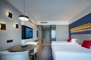 Postel nebo postele na pokoji v ubytování Tian Yi International Hotel 天艺国际酒店