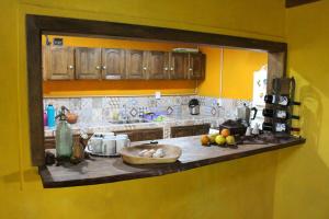 a kitchen with a counter with fruit on it at Yateí-house in El Soberbio