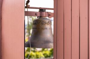 a bell in a window of a building at ODELYA - Stadthotel im Park in Basel