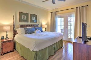 a bedroom with a large bed and a television at Luxury 3BR Reunion Resort Condo Near Disney Golf & Pools in Kissimmee +22 photos