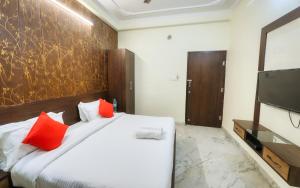 Postel nebo postele na pokoji v ubytování Hotel Pulse Inn- Near Jaipur Train Station