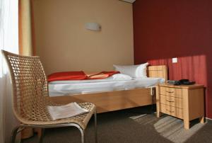Postel nebo postele na pokoji v ubytování Dünenhotel Borkum