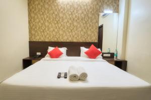 Postel nebo postele na pokoji v ubytování Hotel Pulse Inn- Near Jaipur Train Station