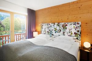 Postel nebo postele na pokoji v ubytování Small Luxury Hotel of the World - DasPosthotel