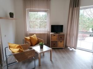 A television and/or entertainment centre at Óvár Apartman