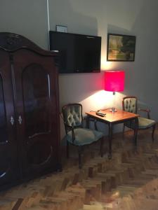 TV in/ali zabaviščno središče v nastanitvi Guest House Anna Caffe