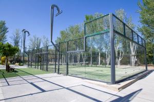 a basketball court in a park with glass at Tamarit Beach Resort in Tamarit