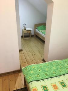 Postelja oz. postelje v sobi nastanitve Guest House Anna Caffe