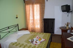 Postel nebo postele na pokoji v ubytování Hotel Hani Zisi