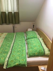 Postelja oz. postelje v sobi nastanitve Guest House Anna Caffe