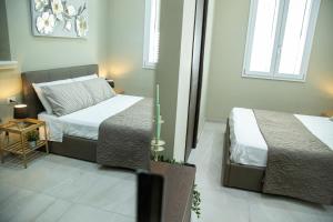 A bed or beds in a room at House Orlando
