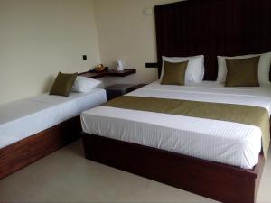 Letto o letti in una camera di Hotel Samanala Sigiriya