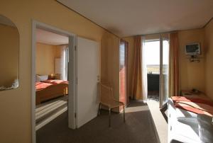 Postel nebo postele na pokoji v ubytování Dünenhotel Borkum