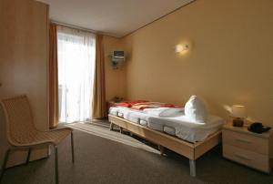 Säng eller sängar i ett rum på Dünenhotel Borkum