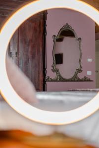a reflection of a person standing in front of a mirror at B&B Gli Archi in Abbadia San Salvatore