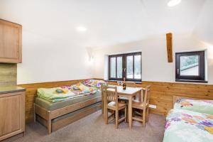 Postel nebo postele na pokoji v ubytování Apartmany Na Salasi