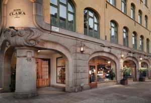 a building with a clock on the front of it at Miss Clara by Nobis, Stockholm, a Member of Design Hotels™ in Stockholm